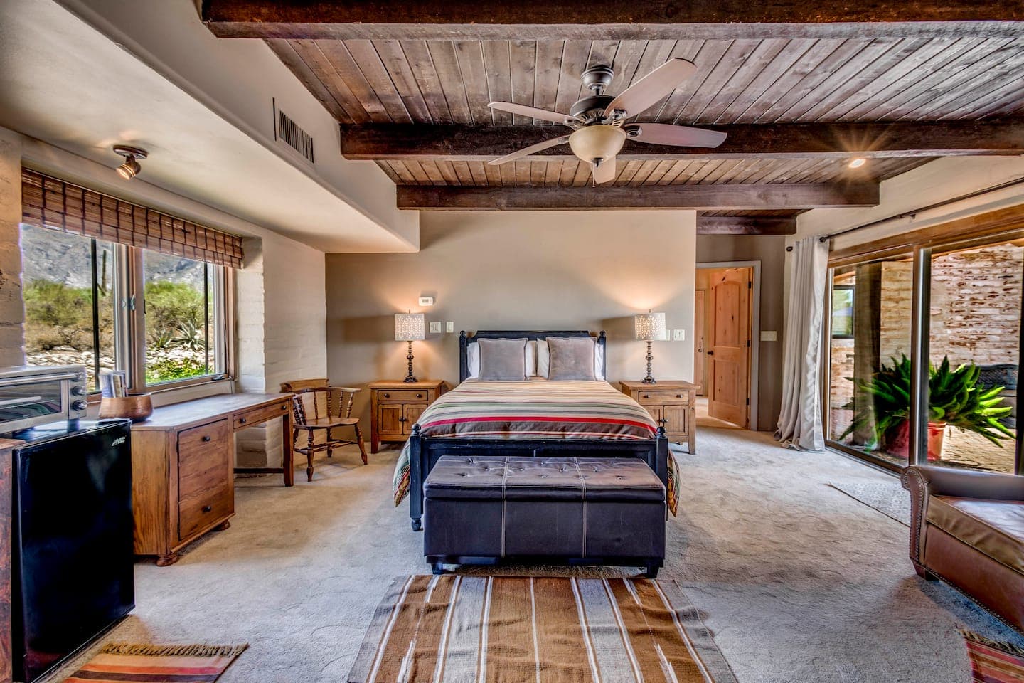Red Suite — interior with fireplace and wood-beam ceiling